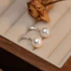 S925 Silver CZ Paved Shell Pearl Drop Earrings S925 Silver CZ Paved Shell Pearl Drop Earrings