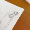S925 Silver Paved CZ Cross‑Detail Huggie Earrings S925 Silver Paved CZ Cross‑Detail Huggie Earrings