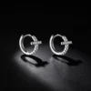 S925 Silver Paved CZ Cross‑Detail Huggie Earrings S925 Silver Paved CZ Cross‑Detail Huggie Earrings